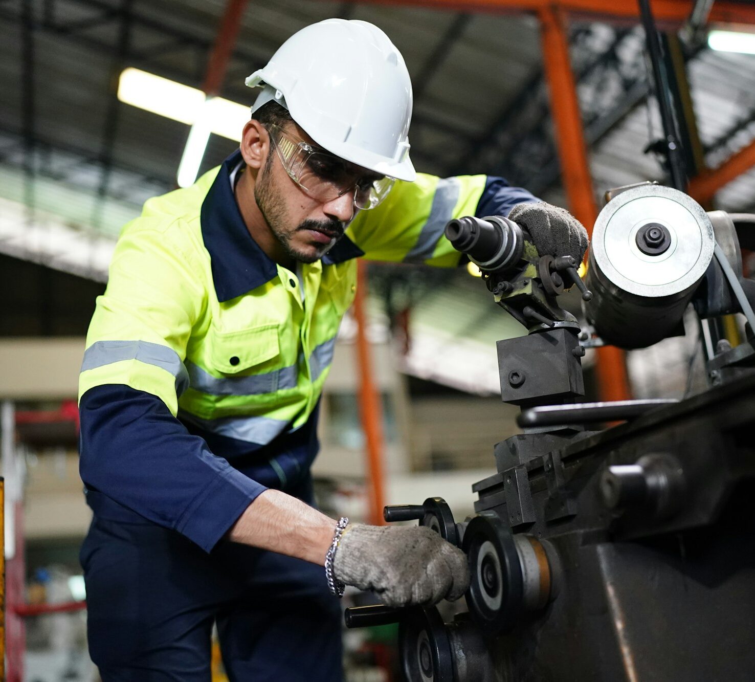 industrial factory worker working in metal manufacturing industry
